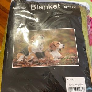 Soft blanket with beagles in it. Size is 50x60.